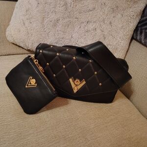 Elegant Black Quilted Women's Bag with Gold Accents
